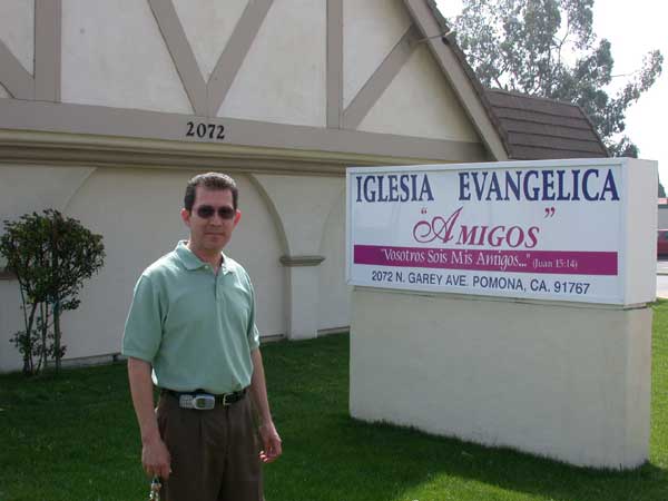 Pastor Arnoldo Garcia in front of Church